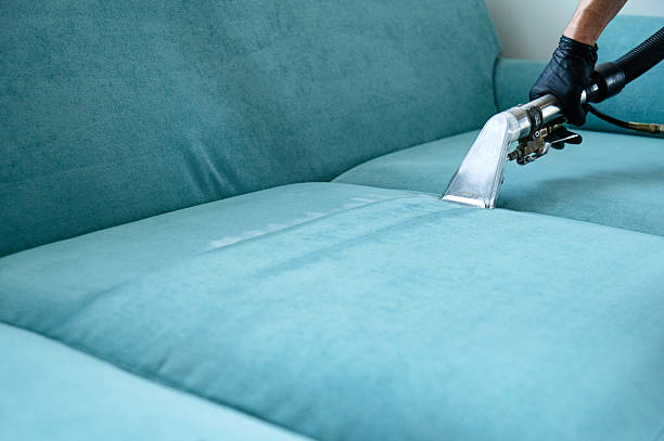 Experienced cleaner detailing bathroom surfaces and fixtures with organized cleaning tools