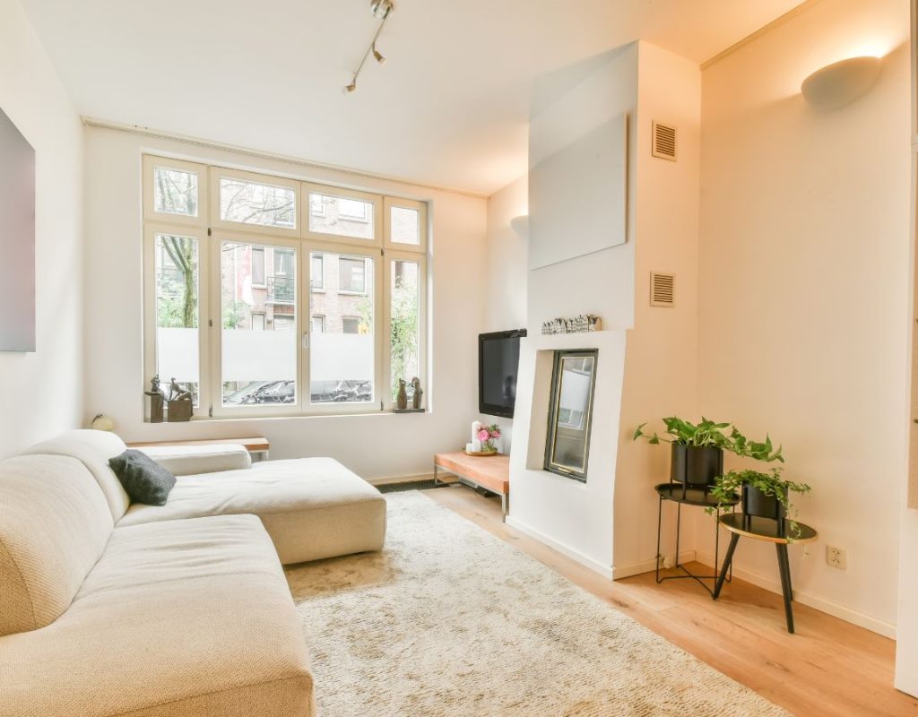 House Cleaning Professional cleaner vacuuming modern living room in Apex, NC home
